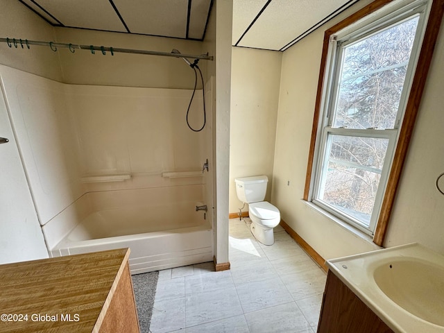 full bathroom featuring tile flooring, toilet, shower / tub combination, and plenty of natural light