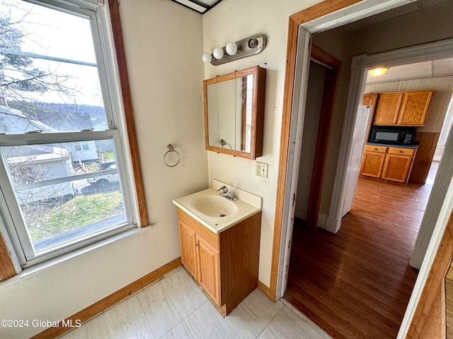 bathroom with vanity and tile floors