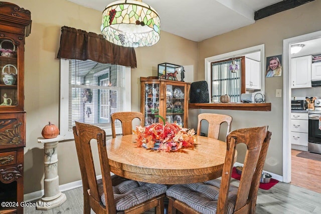 dining area featuring hardwood / wood-style flooring