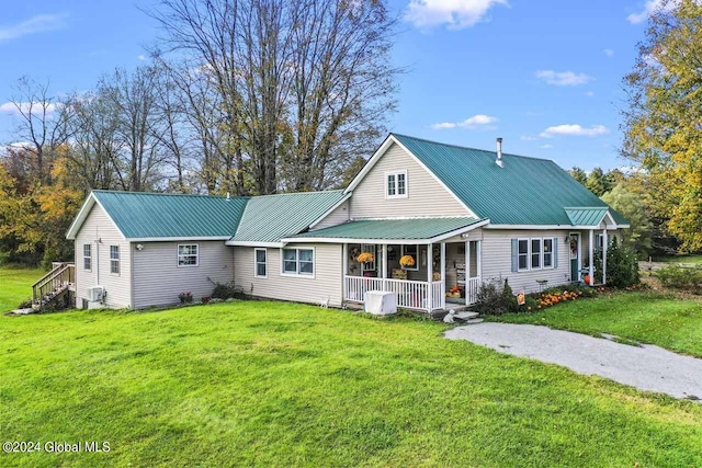 view of front of home with a front yard and covered porch