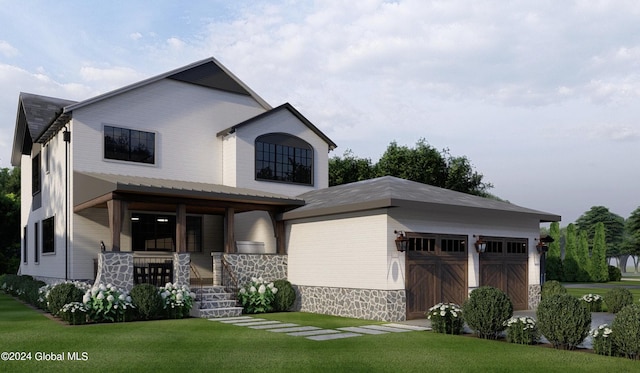 view of front of home featuring a porch, a garage, and a front yard