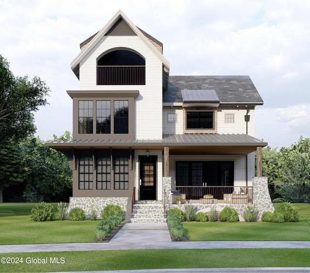 view of front of home featuring a front yard, solar panels, and a porch