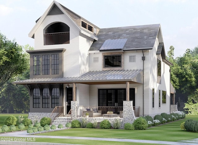 view of front of house with a front yard, solar panels, and a porch