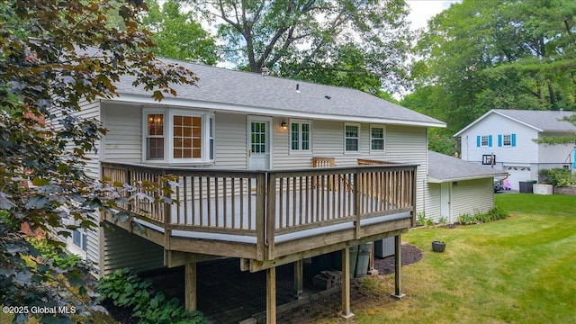 12 Lori Ln, Clifton Park, NY 12065 - rear view of property featuring a deck, a yard, and a shingled roof