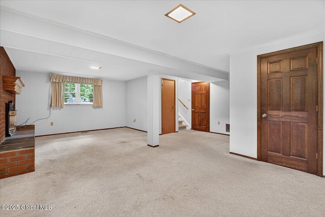 12 Lori Ln, Clifton Park, NY 12065 - below grade area with carpet floors, stairway, and a brick fireplace