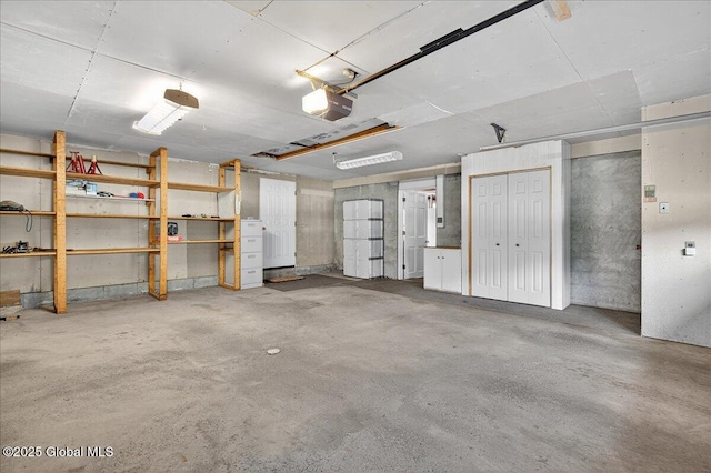 12 Lori Ln, Clifton Park, NY 12065 - garage featuring a garage door opener