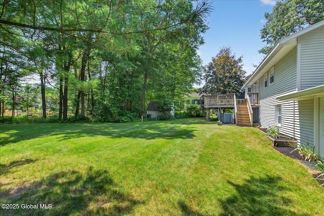 12 Lori Ln, Clifton Park, NY 12065 - view of grassy yard with stairway and a wooden deck