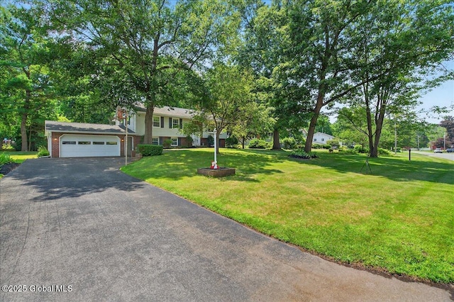12 Lori Ln, Clifton Park, NY 12065 - view of front of home featuring driveway, a garage, a front yard, and brick siding
