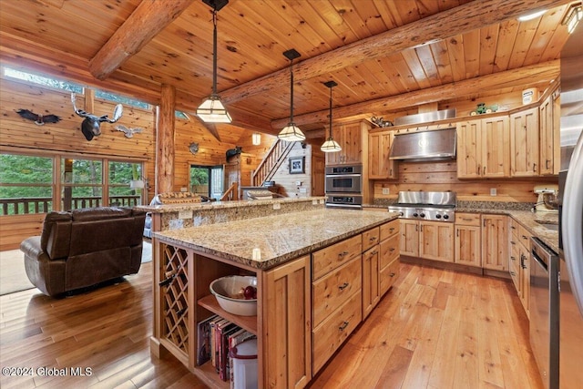 kitchen with wooden walls, pendant lighting, beam ceiling, wooden ceiling, and light hardwood / wood-style floors