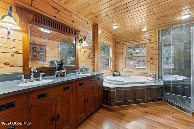 bathroom featuring wooden ceiling, wood-type flooring, wooden walls, vanity, and independent shower and bath