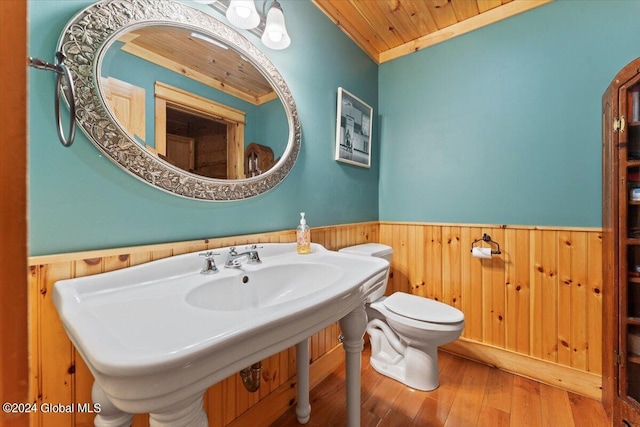 bathroom with wood ceiling, crown molding, sink, wood-type flooring, and toilet