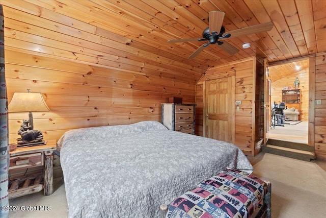 bedroom with carpet flooring, vaulted ceiling, ceiling fan, wooden walls, and wooden ceiling