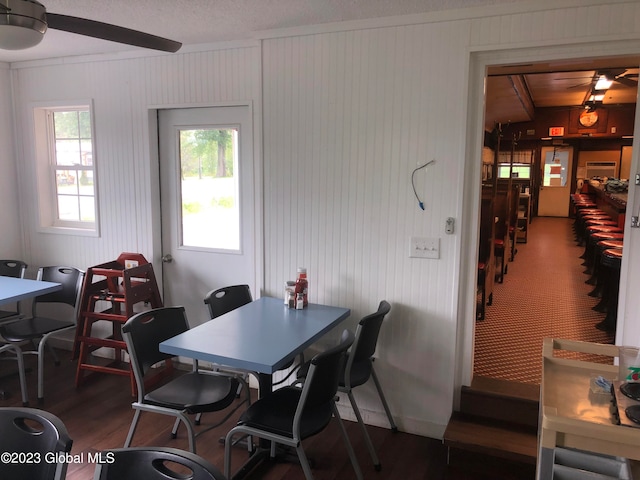 dining room featuring wood-type flooring and ceiling fan