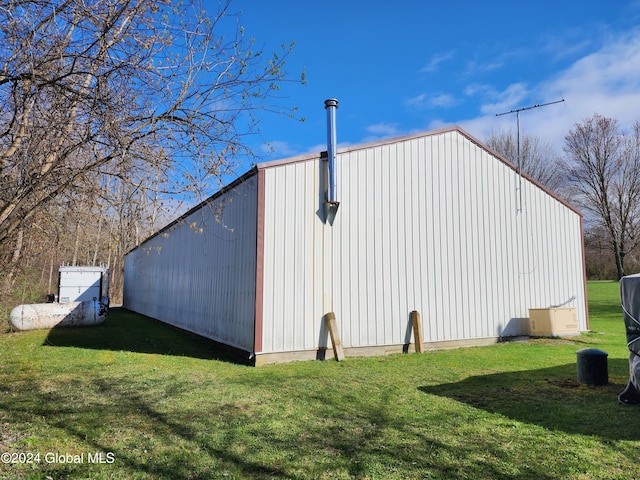 view of shed / structure with a lawn