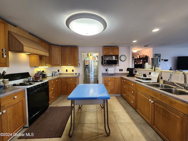 kitchen with premium range hood, sink, stainless steel appliances, and light tile floors