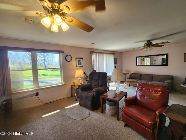 living room featuring carpet flooring and ceiling fan