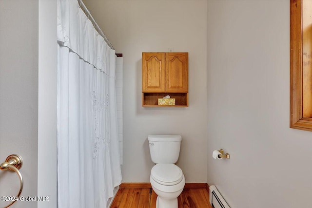 bathroom with toilet, wood-type flooring, and a shower with shower curtain