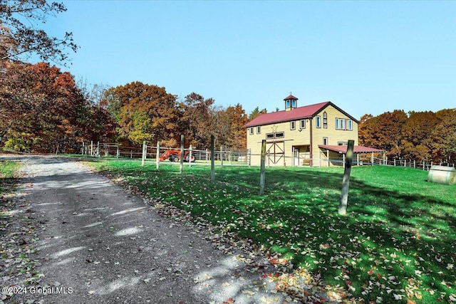 view of home's community with a yard