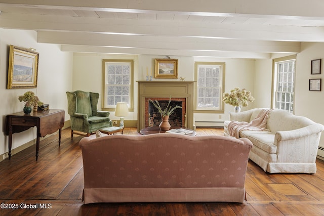 living room with a brick fireplace, wooden ceiling, baseboard heating, wood-type flooring, and beam ceiling