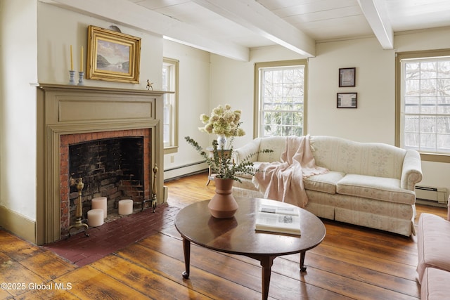 living room featuring beam ceiling, dark hardwood / wood-style floors, and a baseboard radiator