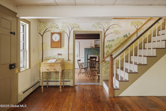 entryway featuring a baseboard heating unit, dark wood-type flooring, and a healthy amount of sunlight