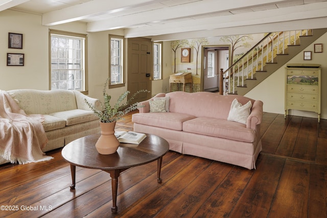 living room featuring beam ceiling and dark hardwood / wood-style floors