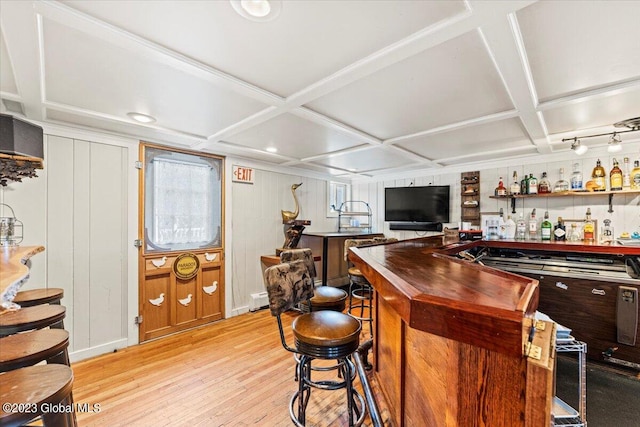 bar with coffered ceiling, light hardwood / wood-style floors, and baseboard heating