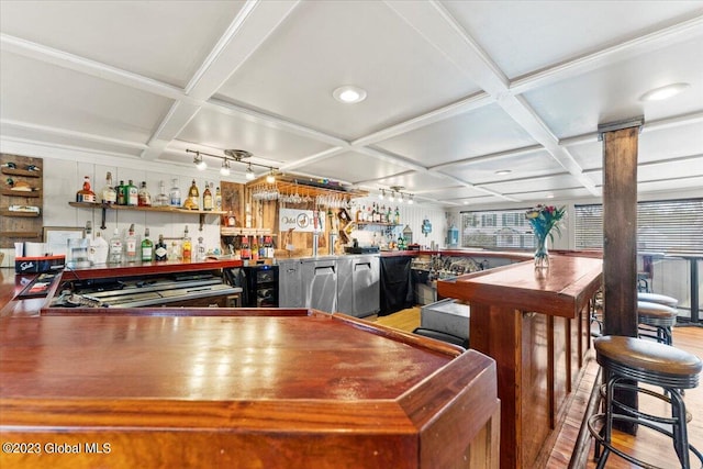 interior space with rail lighting, hardwood / wood-style floors, and coffered ceiling