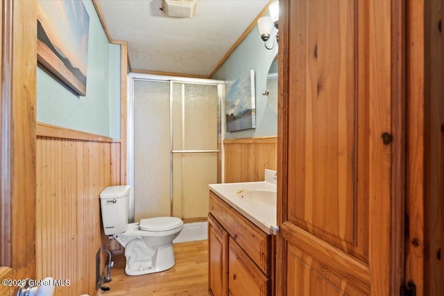 bathroom with wood-type flooring, vanity, and toilet