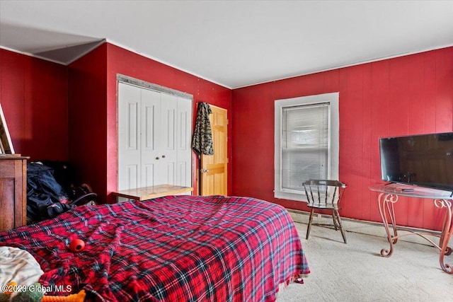 bedroom with carpet and a closet