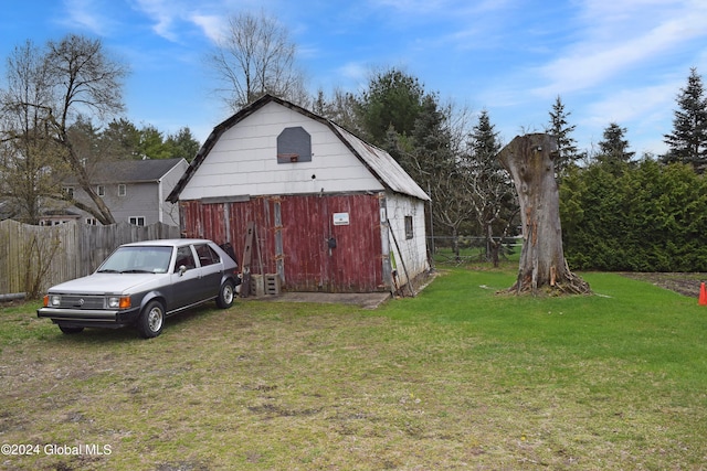 view of outdoor structure featuring a yard