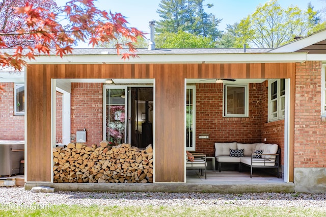 rear view of house featuring central AC and an outdoor living space