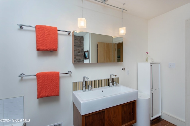 bathroom featuring hardwood / wood-style floors and vanity