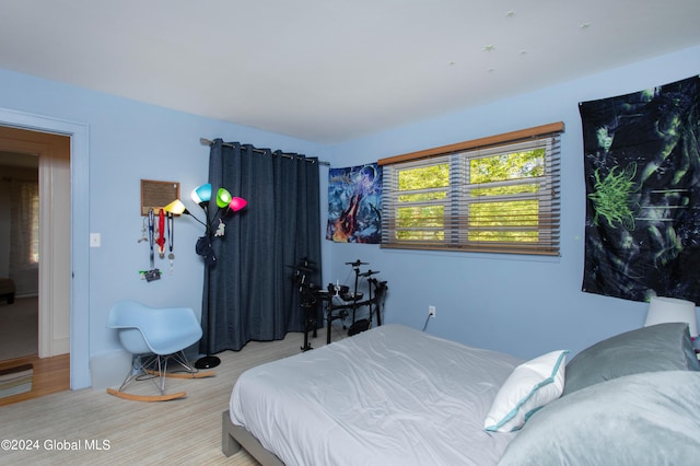 bedroom with light hardwood / wood-style floors