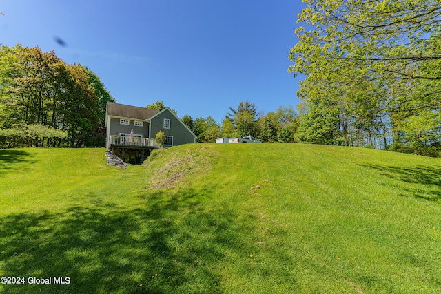 view of yard featuring a wooden deck