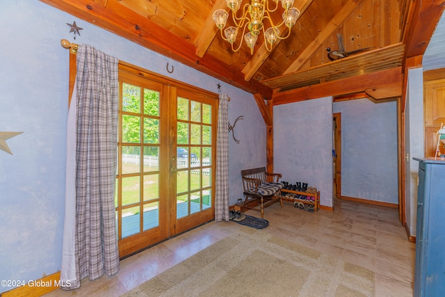 interior space with wooden ceiling, french doors, light tile flooring, and a chandelier