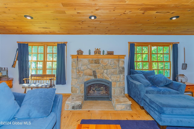 living room featuring wooden ceiling, hardwood / wood-style floors, and a fireplace