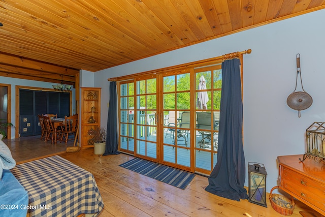 interior space featuring hardwood / wood-style floors and wood ceiling