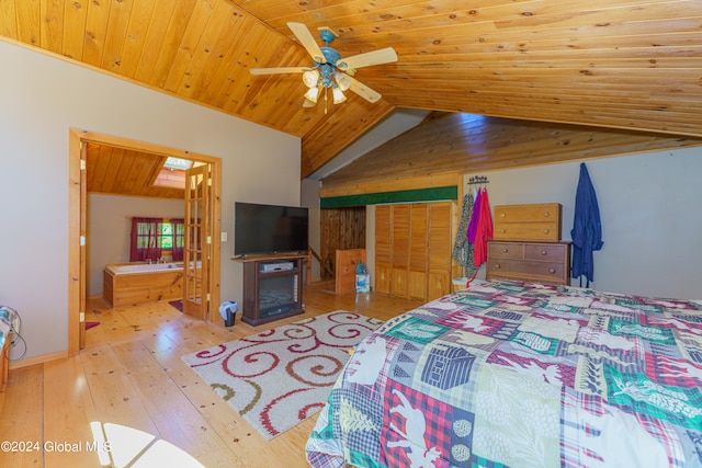 bedroom featuring ceiling fan, vaulted ceiling, connected bathroom, and wood ceiling