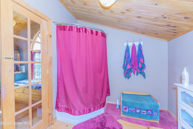 bathroom with wooden ceiling and vaulted ceiling