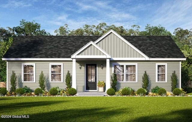 6 Killington Ln, Johnstown, NY 12095 - view of front facade featuring a front lawn, board and batten siding, and a shingled roof