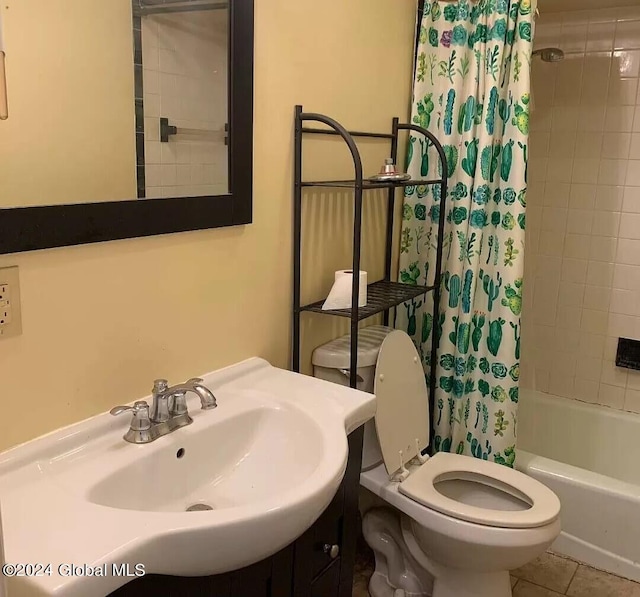 full bathroom featuring tile flooring, shower / bath combo, oversized vanity, and toilet