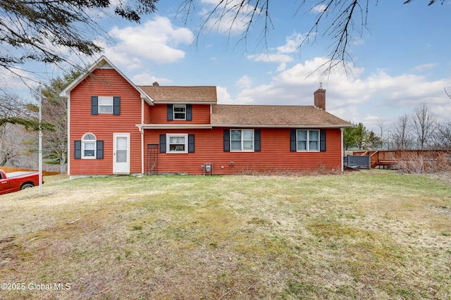 86 W State St, Gloversville, NY 12078 - back of property featuring a chimney, a shingled roof, and a lawn