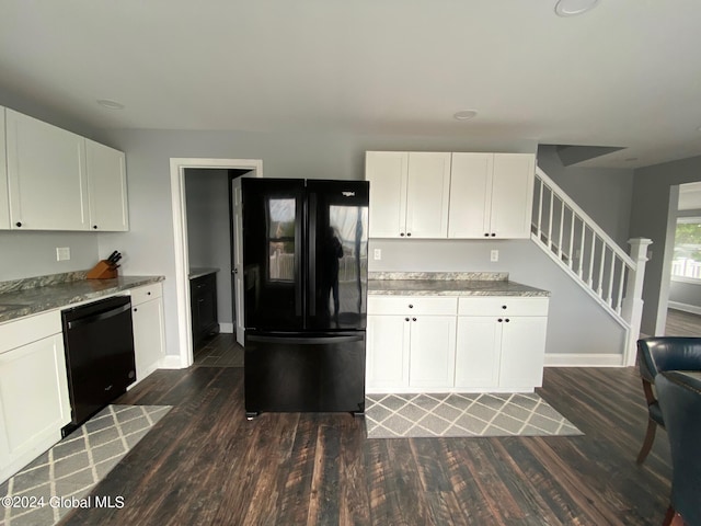 kitchen featuring dark wood-type flooring, white cabinets, and black appliances