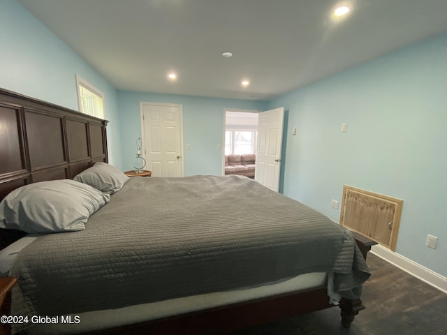 bedroom featuring dark wood-type flooring