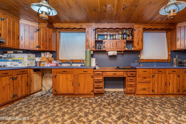 kitchen with ventilation hood, sink, tasteful backsplash, and wood ceiling