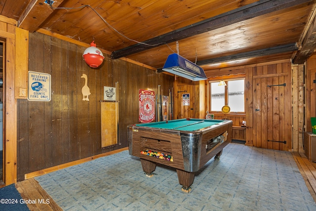 rec room featuring wood walls, beamed ceiling, and wood ceiling