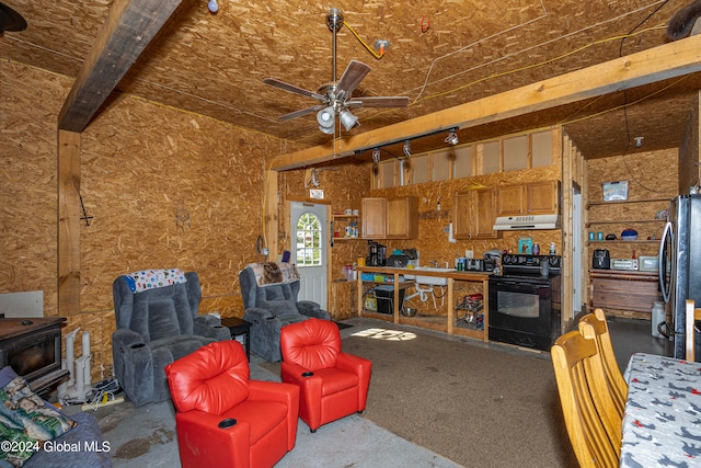 living room with beam ceiling and ceiling fan