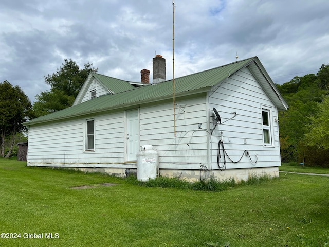 view of home's exterior featuring a yard