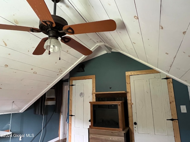 interior space featuring vaulted ceiling and ceiling fan